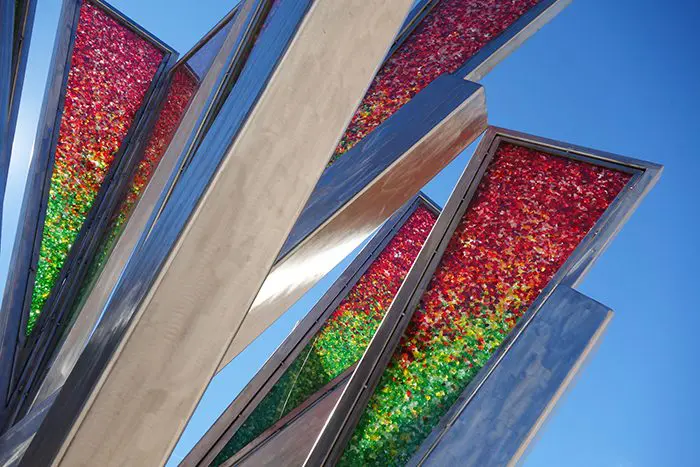 A close up of the colorful glass panels on a building