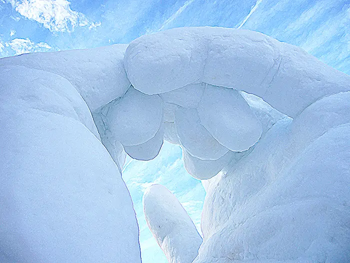 A close up of two hands making a heart shape